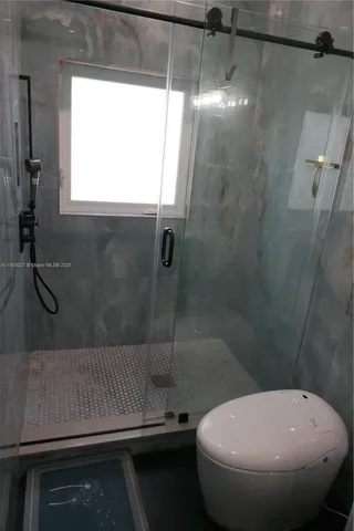 a kitchen with granite countertop a sink stove and refrigerator