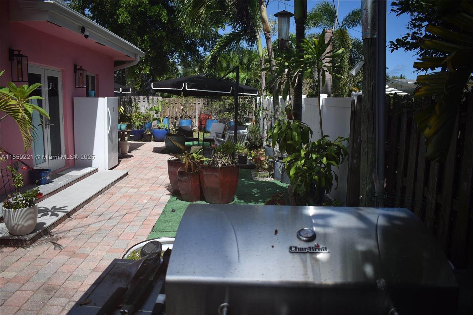 524 Northeast 27th Drive Wilton Manors, FL 33334 - Photo 34 of 95 a view of house with patio outdoor seating