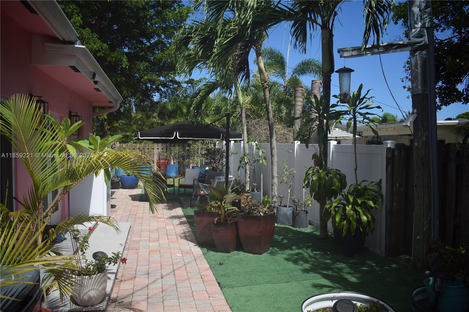 524 Northeast 27th Drive Wilton Manors, FL 33334 - Photo 35 of 95 Lush garden setting with a variety of plants and thoughtfully designed zones for outdoor enjoyment