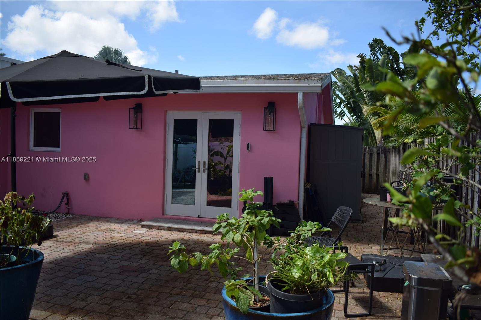 524 Northeast 27th Drive Wilton Manors, FL 33334 - Photo 36 of 95 a front view of a house with a yard