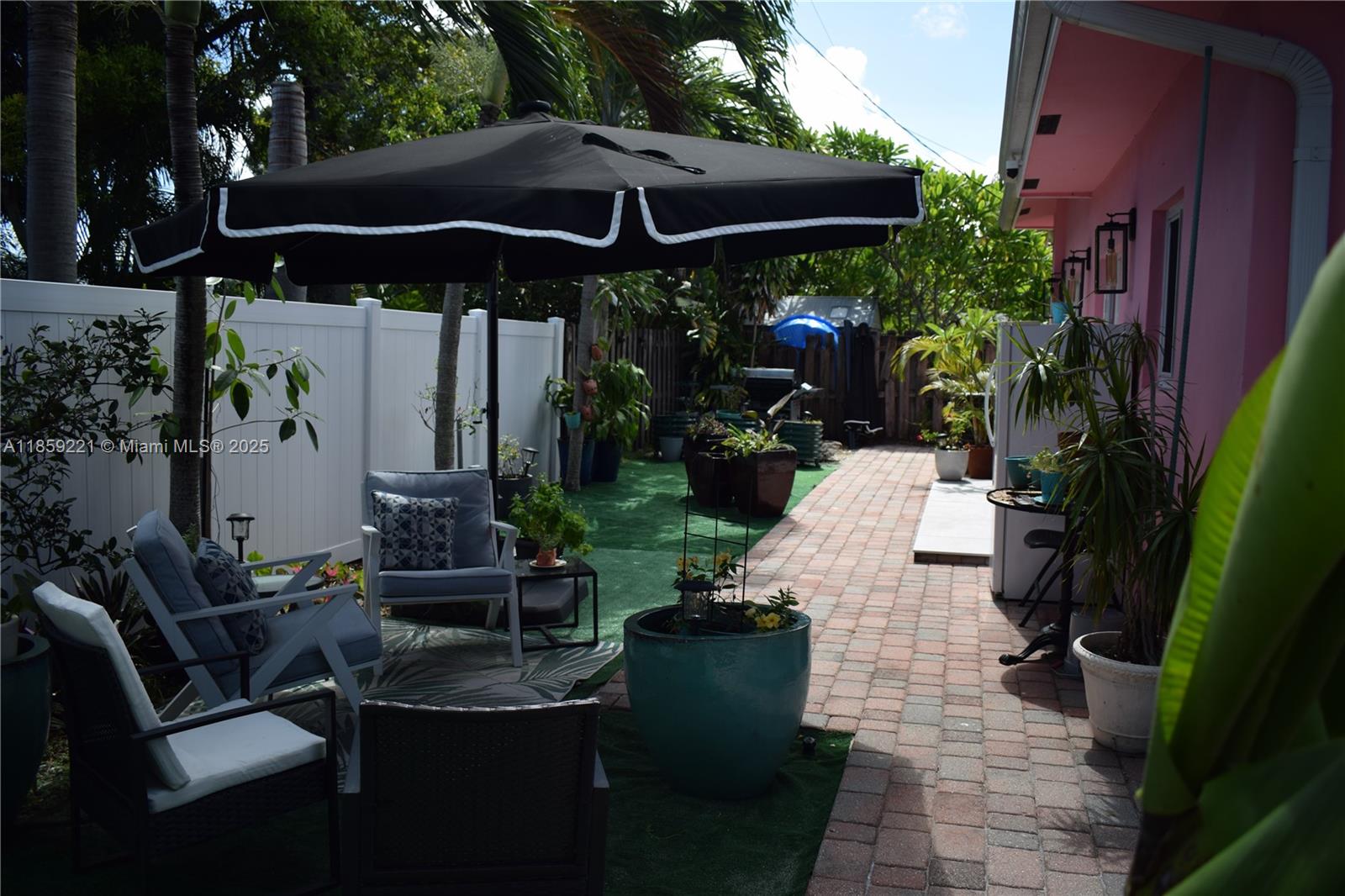 524 Northeast 27th Drive Wilton Manors, FL 33334 - Photo 37 of 95 a view of outdoor space yard deck patio and swimming pool