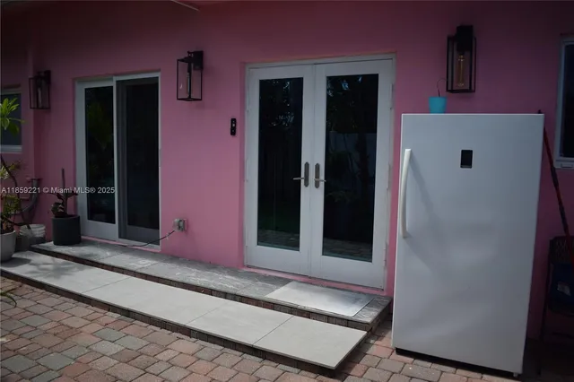 a bedroom with a large bed and a large window