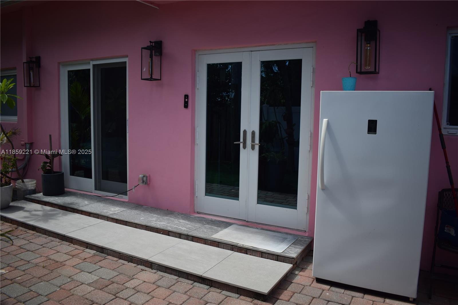 524 Northeast 27th Drive Wilton Manors, FL 33334 - Photo 41 of 95 The home offers several direct connections to the rear patio—from the kitchen and multiple bedrooms—perfect for entertaining or quiet outdoor moments