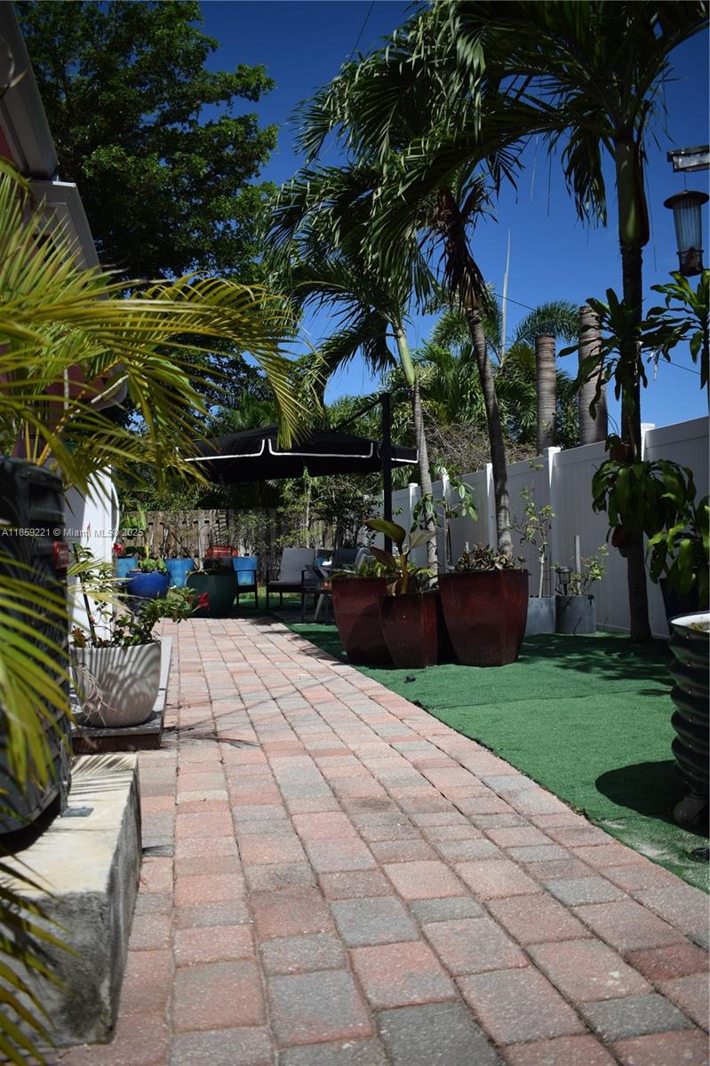 524 Northeast 27th Drive Wilton Manors, FL 33334 - Photo 46 of 95 Backyard features diverse landscaping and multiple areas for relaxation and entertainment
