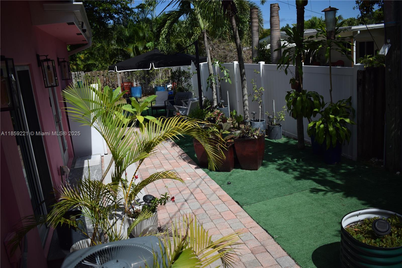 524 Northeast 27th Drive Wilton Manors, FL 33334 - Photo 47 of 95 Spacious backyard layout allows for a variety of cozy outdoor settings.