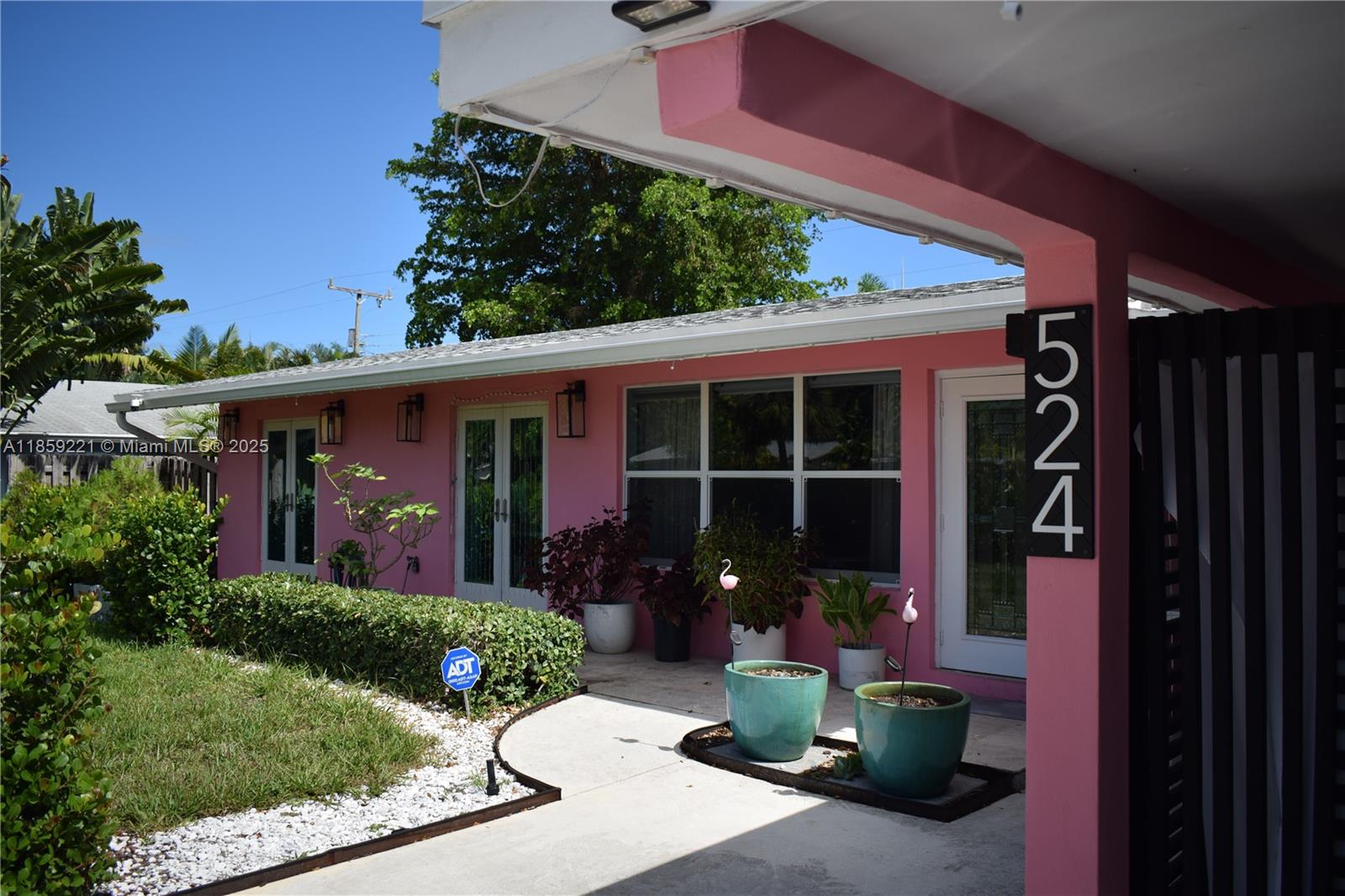 524 Northeast 27th Drive Wilton Manors, FL 33334 - Photo 48 of 95 Easy access to the front entrance with excellent lighting for enhanced safety and convenience