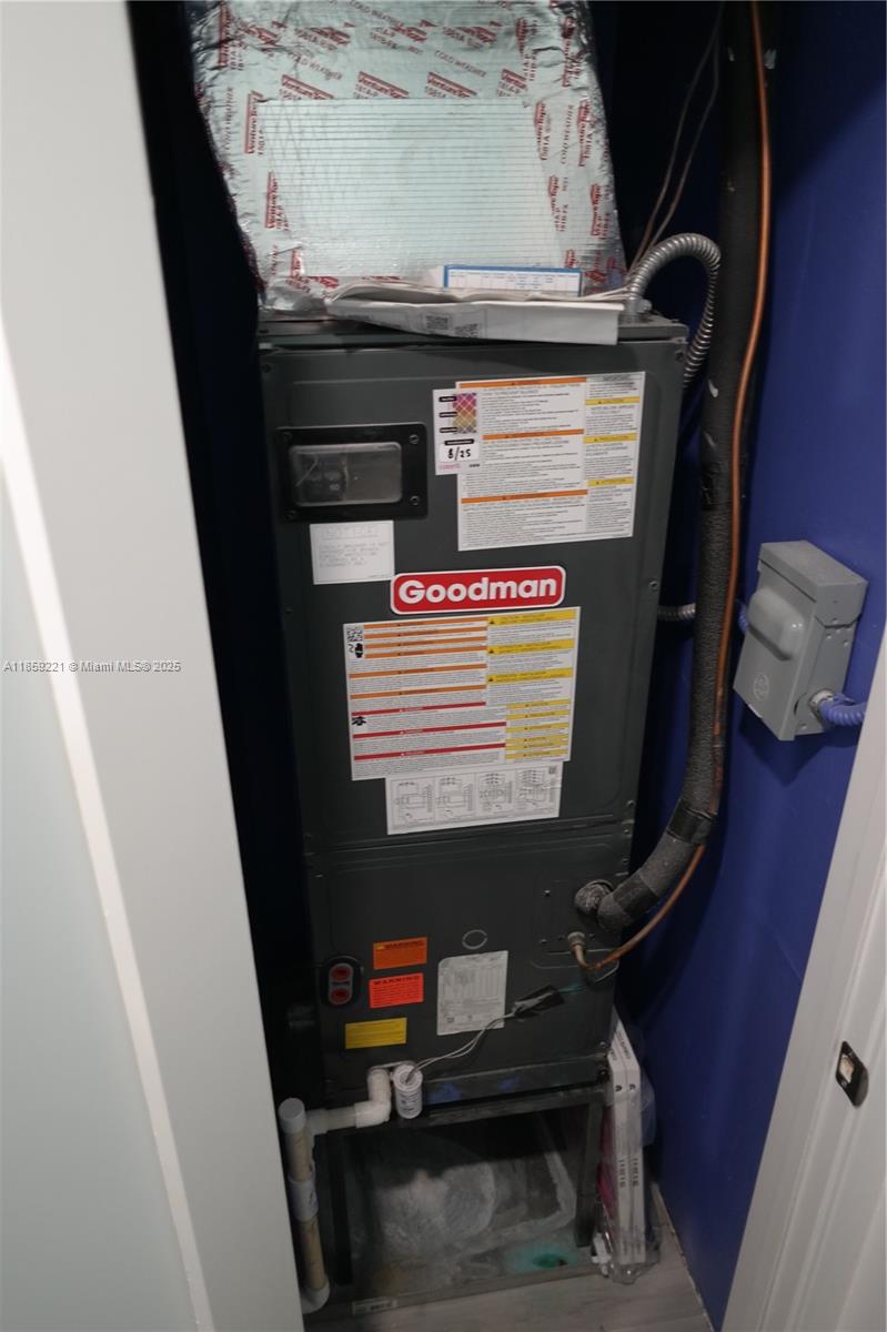 524 Northeast 27th Drive Wilton Manors, FL 33334 - Photo 55 of 95 Modern air handler, under 2 years old, featuring a smart digital thermostat for customizable comfort and energy savings