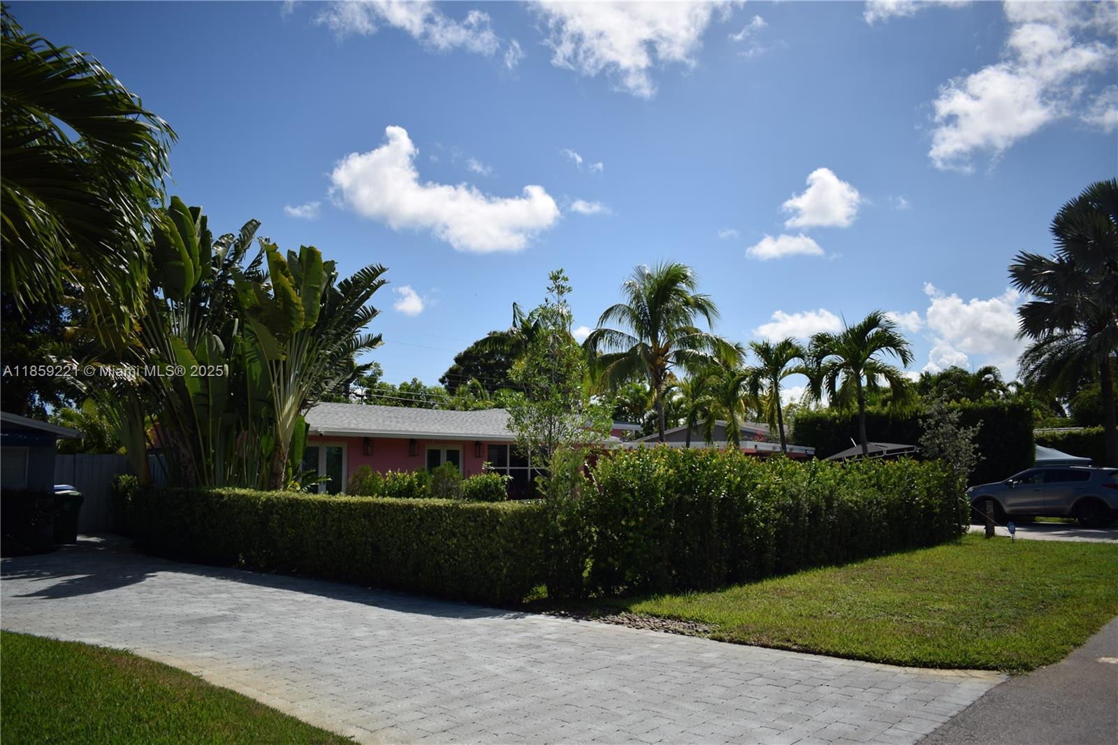 524 Northeast 27th Drive Wilton Manors, FL 33334 - Photo 63 of 95 a front view of a house with a yard