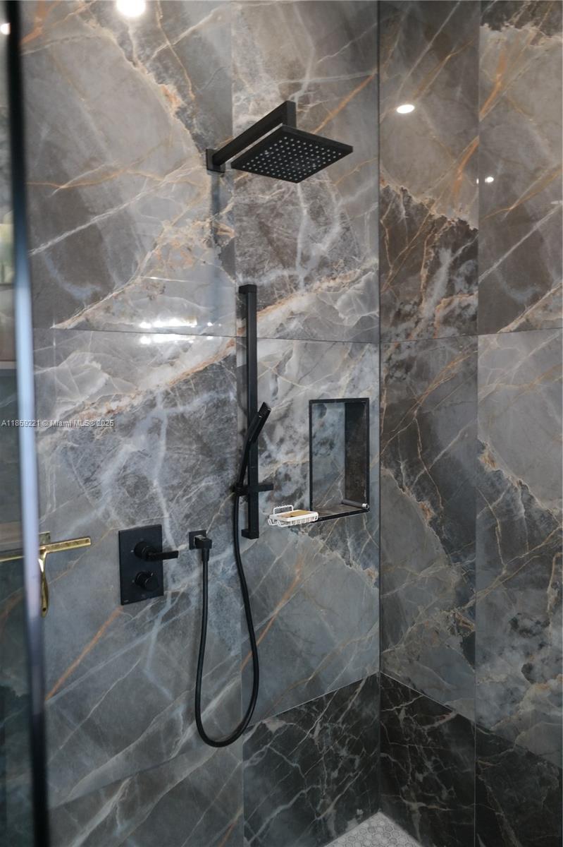 524 Northeast 27th Drive Wilton Manors, FL 33334 - Photo 68 of 95 Thoughtfully selected bathroom features offer a spa-like experience, combining functionality with refined comfort