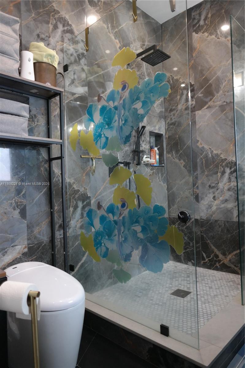 524 Northeast 27th Drive Wilton Manors, FL 33334 - Photo 72 of 95 a bathroom with a sink and toilet