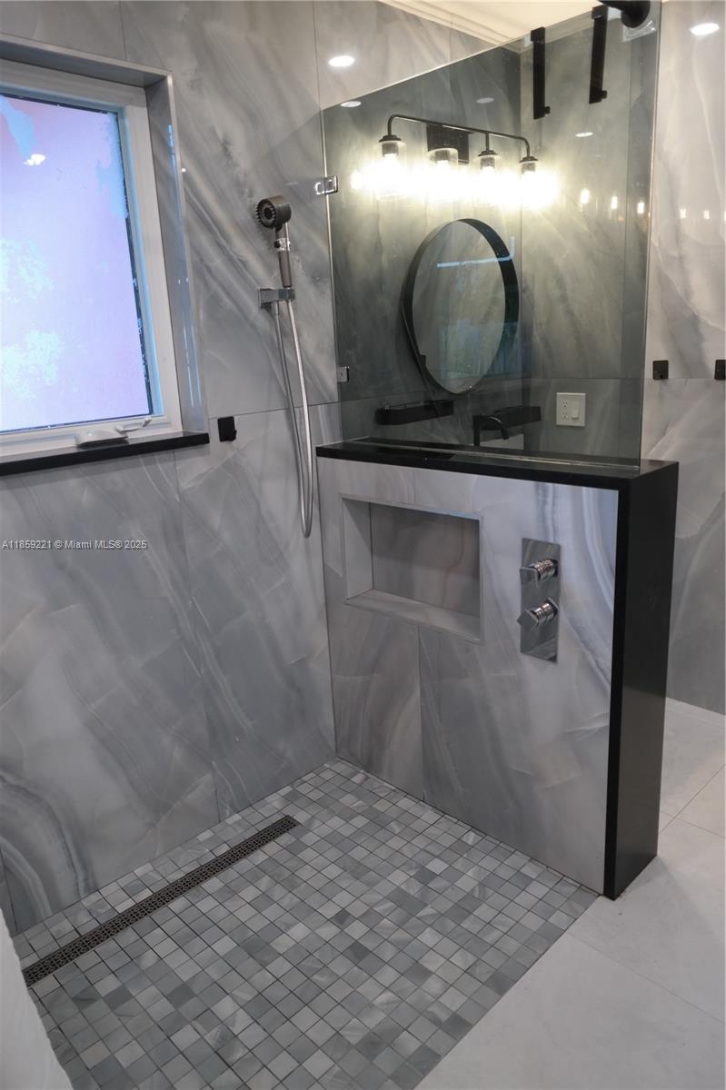 524 Northeast 27th Drive Wilton Manors, FL 33334 - Photo 73 of 95 Functional bathroom enhancements deliver a spa-like experience with easy-access features designed for comfort and relaxation