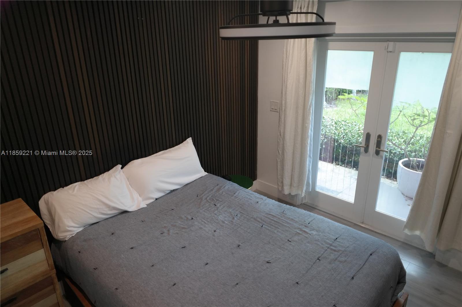 524 Northeast 27th Drive Wilton Manors, FL 33334 - Photo 76 of 95 a bedroom with a bed and a window