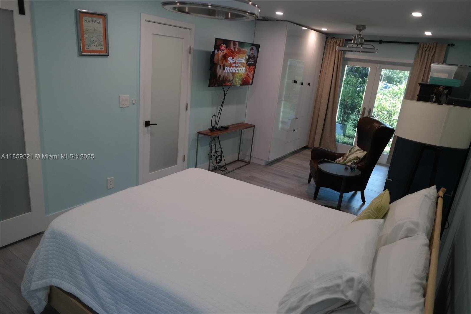 524 Northeast 27th Drive Wilton Manors, FL 33334 - Photo 79 of 95 a bed room with a bed and a television