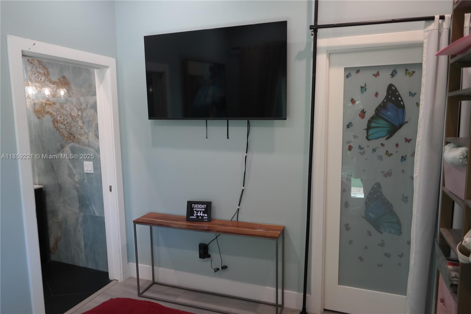 524 Northeast 27th Drive Wilton Manors, FL 33334 - Photo 85 of 95 Elegant pocket glass-paneled wood doors enhance flow and accessibility across multiple areas of the home