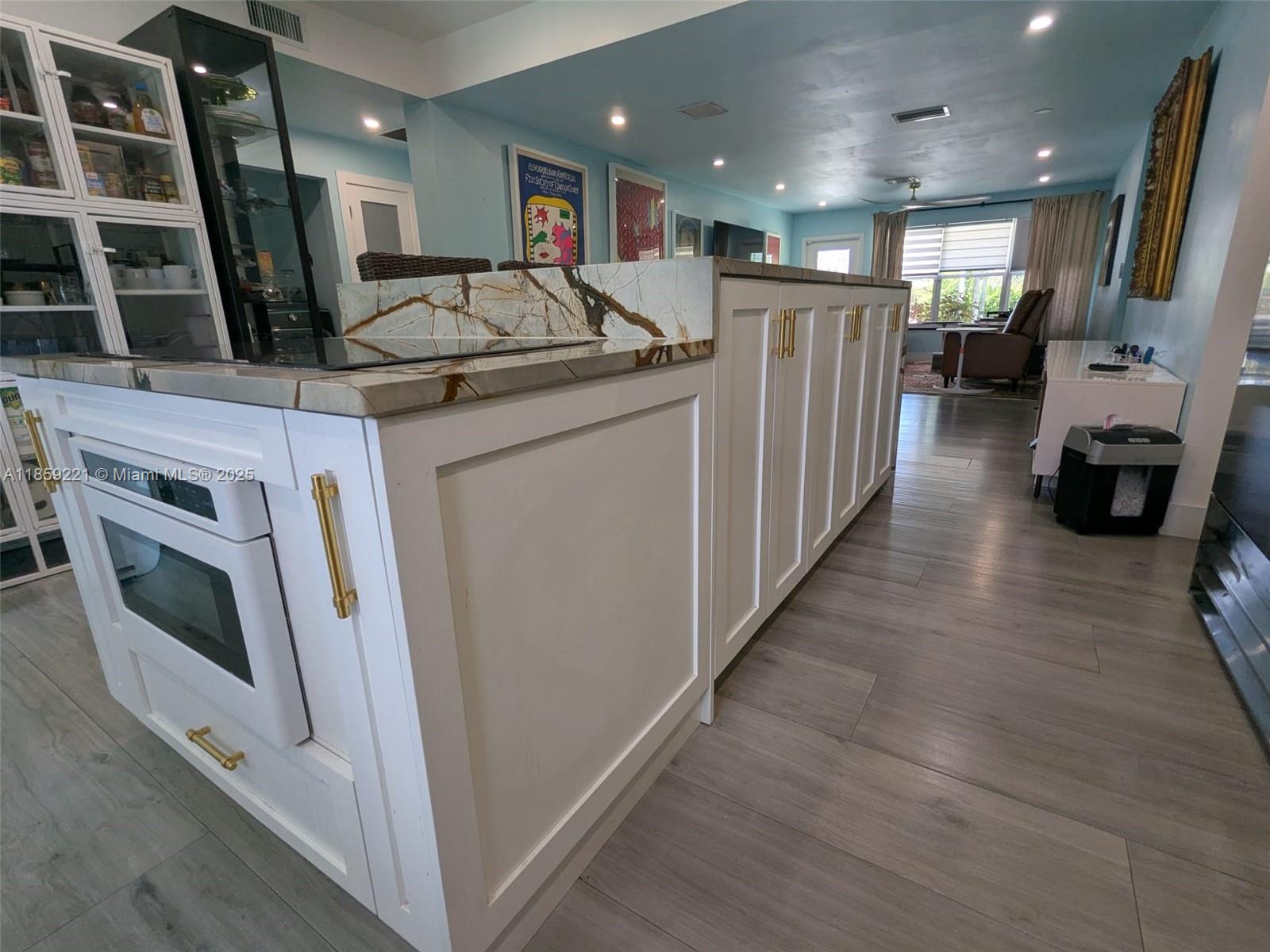 524 Northeast 27th Drive Wilton Manors, FL 33334 - Photo 88 of 95 Expansive white cabinets with designer-grade pulls deliver a polished look, blending modern elegance with timeless charm