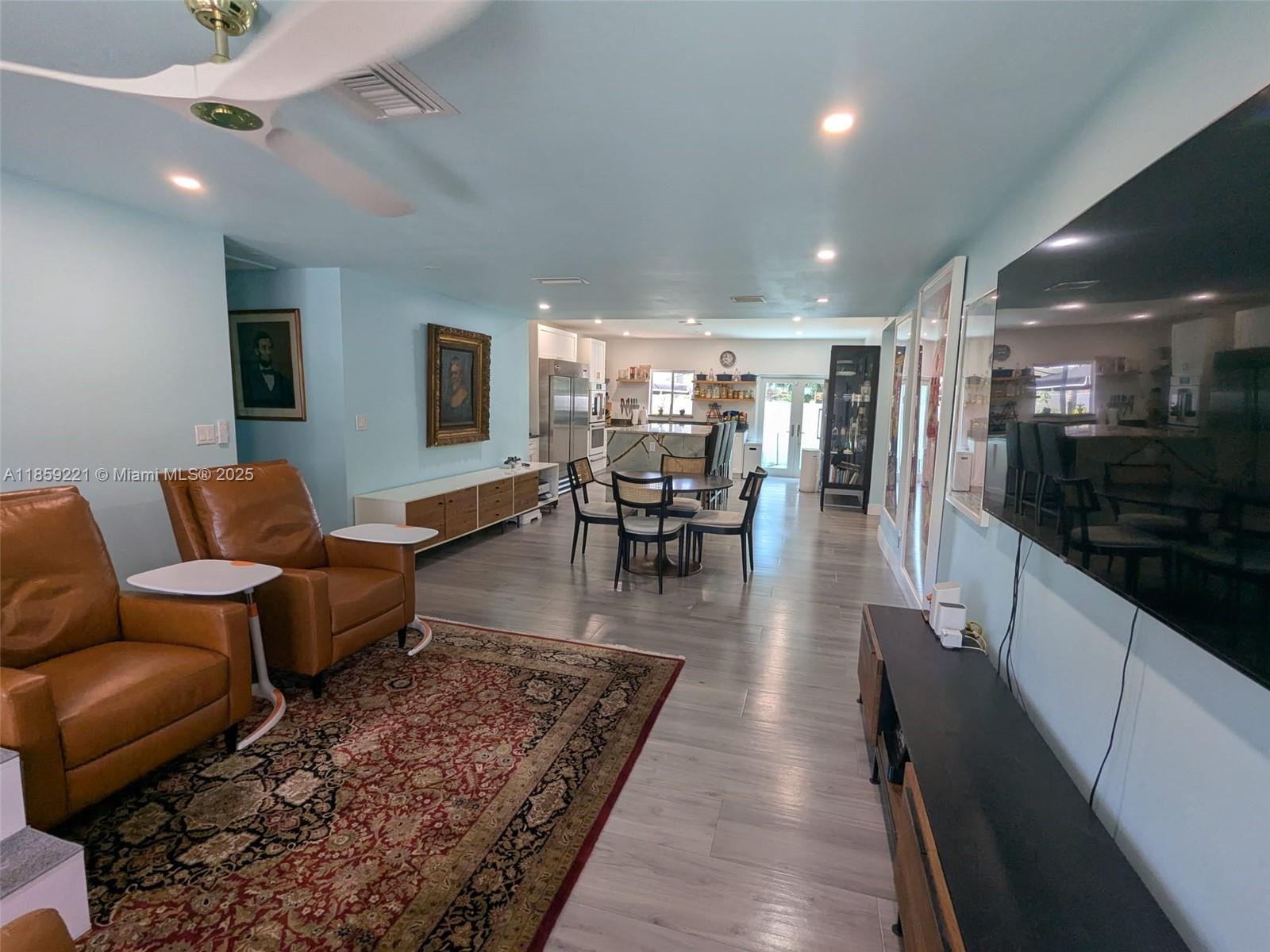 524 Northeast 27th Drive Wilton Manors, FL 33334 - Photo 91 of 95 a living room with furniture and a view of kitchen
