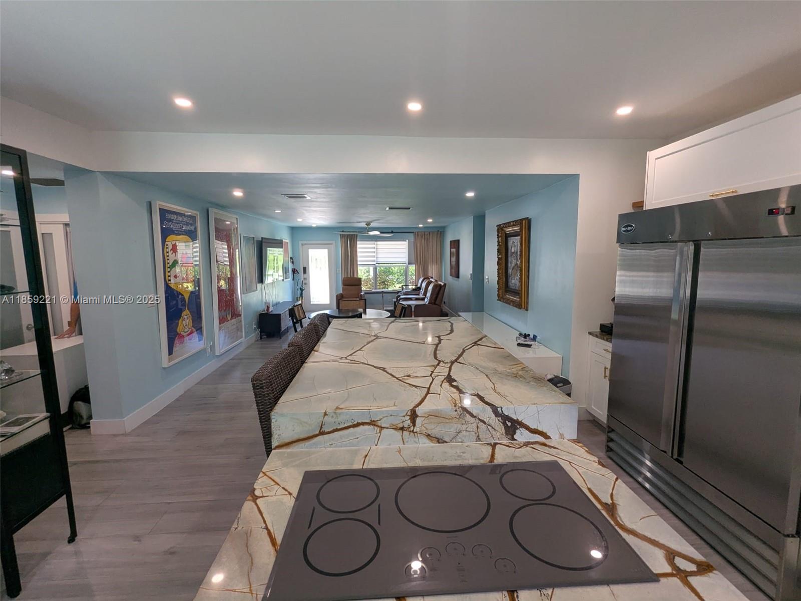 524 Northeast 27th Drive Wilton Manors, FL 33334 - Photo 93 of 95 a large kitchen with a large counter top appliances and furniture