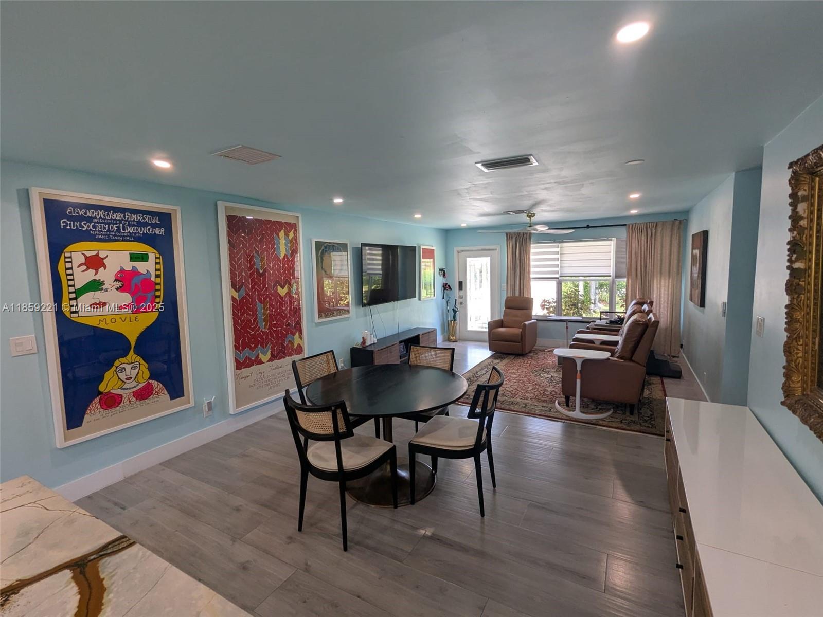 524 Northeast 27th Drive Wilton Manors, FL 33334 - Photo 94 of 95 a living room with furniture and a painting on the wall