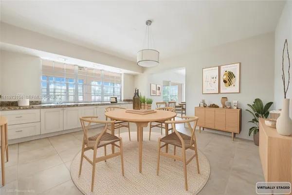 a dining room with furniture and window