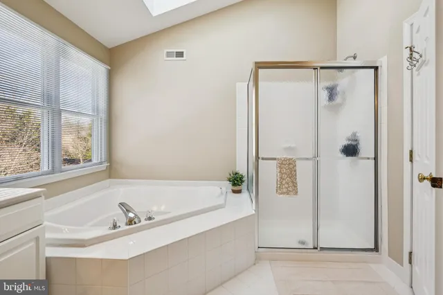 a bathroom with a tub and a sink