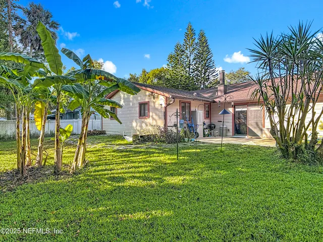 a view of a park with large trees