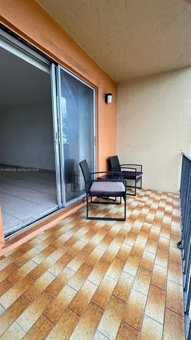 a view of a livingroom with a furniture and a ceiling fan