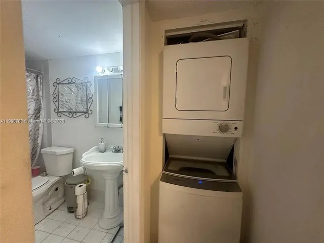 a bathroom with a toilet a sink and a mirror