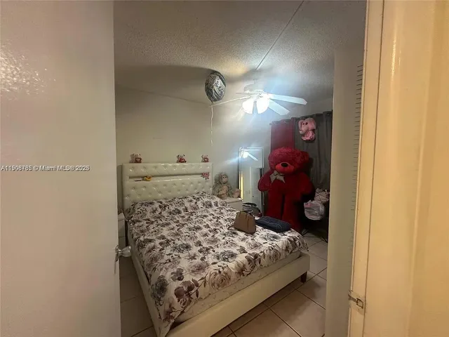 a room with a bed and a lamp