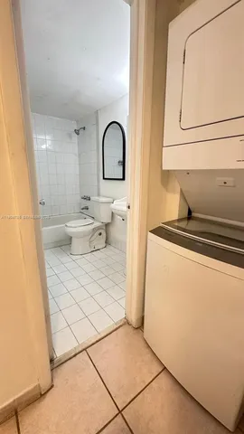 a bathroom with a toilet a sink and a mirror