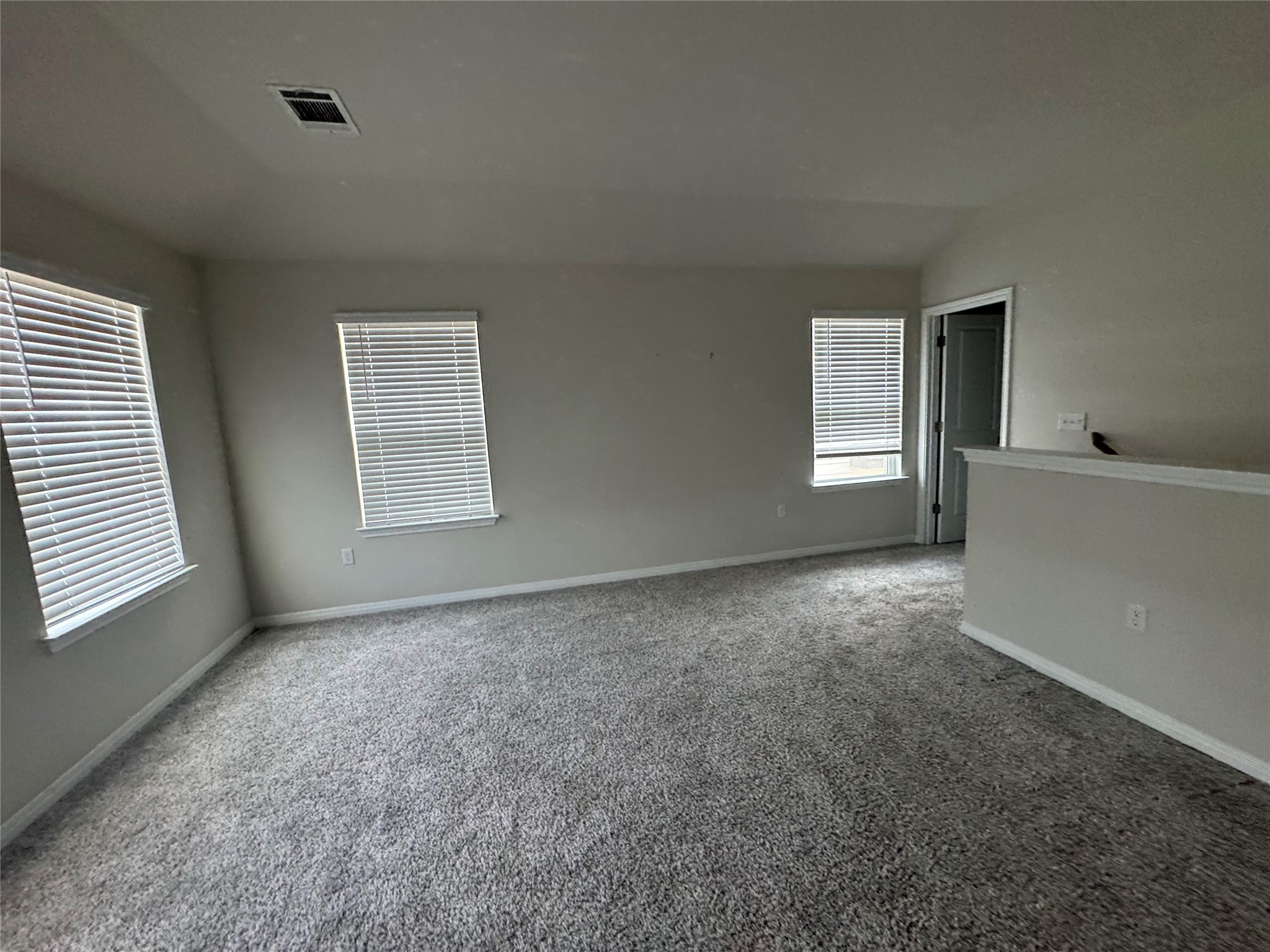 6400 Rounded Pebble Lane Buda, TX 78610 - Photo 8 of 34 a view of an empty room with a window