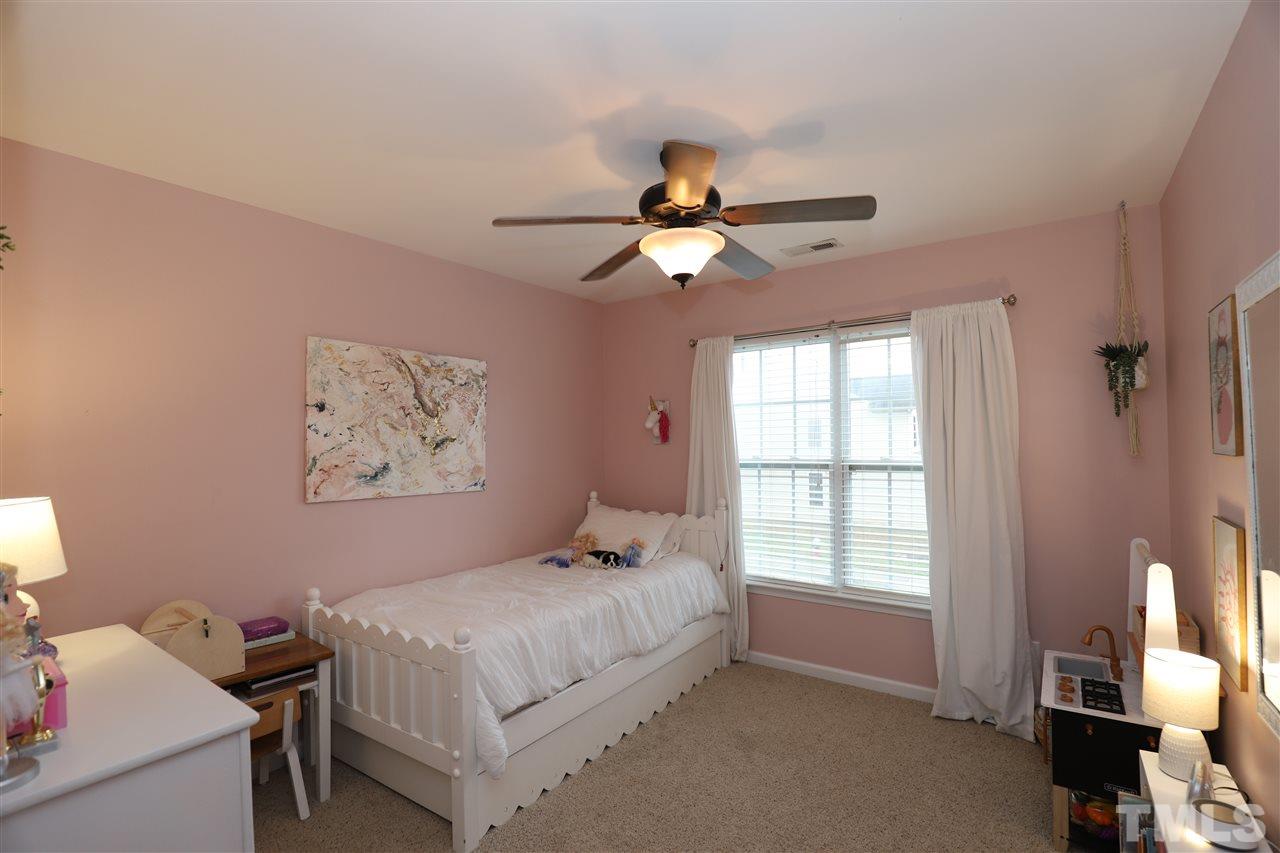8610 Redcrest Place Raleigh, NC 27617 - Photo 17 of 30 a bedroom with a bed and a window