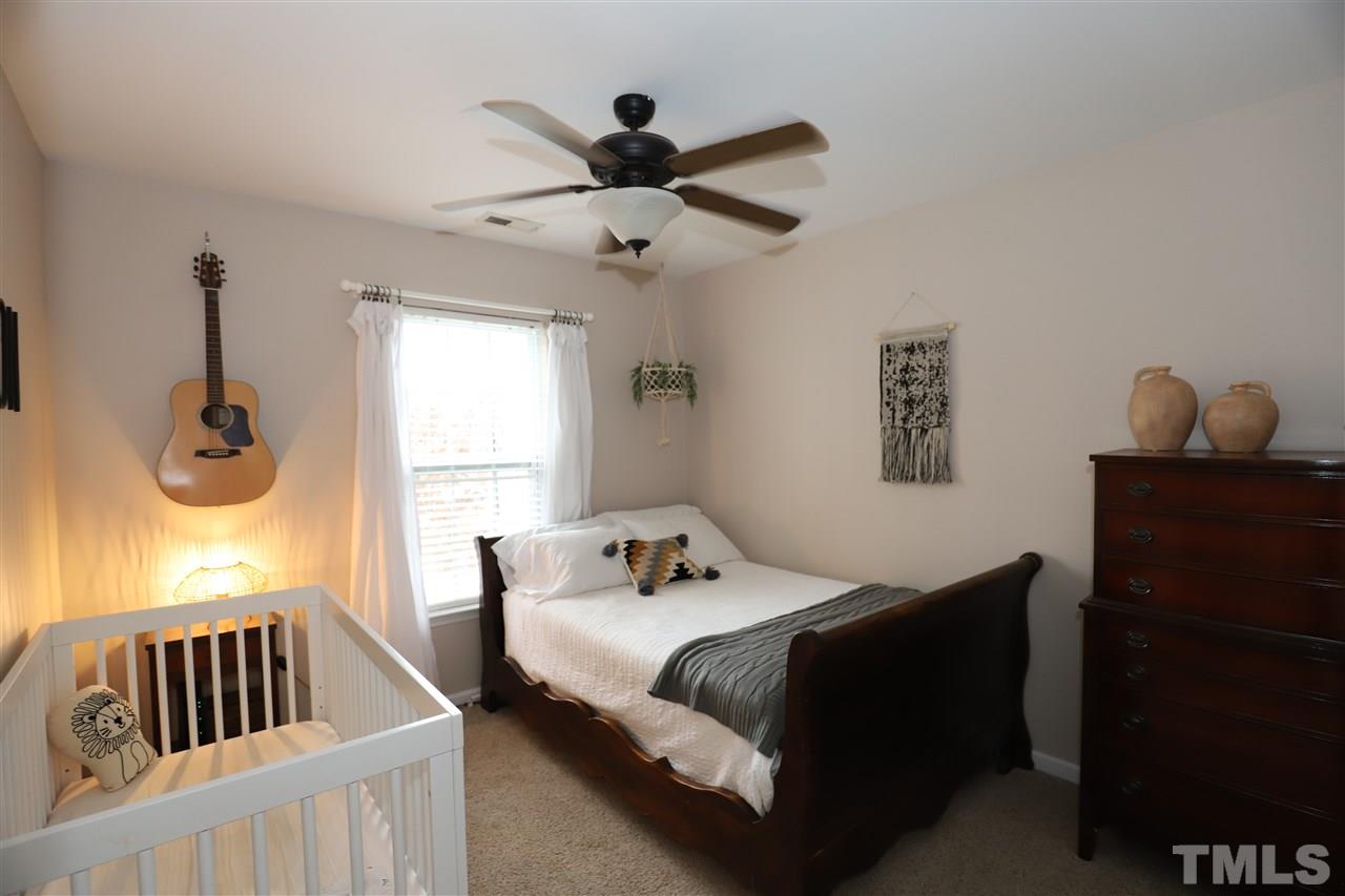 8610 Redcrest Place Raleigh, NC 27617 - Photo 20 of 30 a bedroom with a bed and window