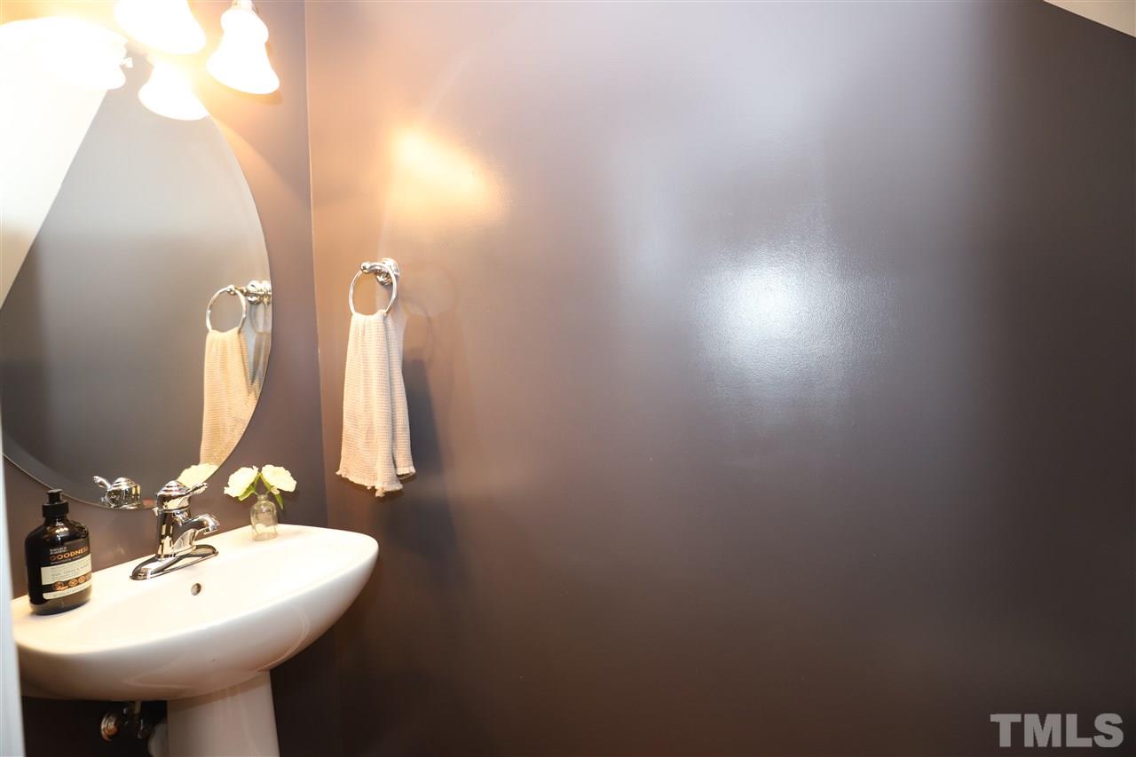 8610 Redcrest Place Raleigh, NC 27617 - Photo 23 of 30 a bathroom with a sink and a mirror