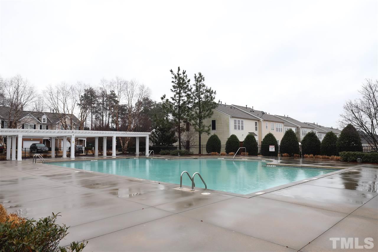 8610 Redcrest Place Raleigh, NC 27617 - Photo 28 of 30 an outdoor view of a house with a yard