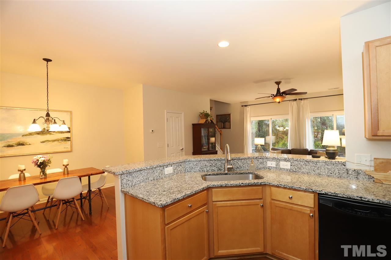 8610 Redcrest Place Raleigh, NC 27617 - Photo 8 of 30 a kitchen with a sink and cabinets
