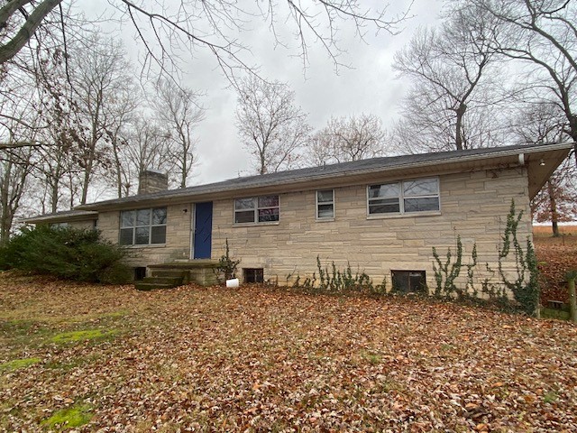 4381 Galen Road Lafayette, TN 37083 - Photo 3 of 17 a backyard of a house with wooden fence and large trees
