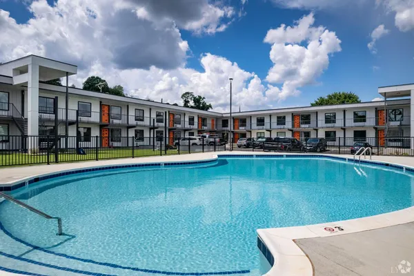 a view of a swimming pool with a patio