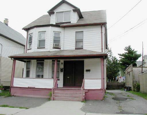 491 Logan Street Bridgeport, CT 06607 - Photo 1 of 1 a house that has a lot of windows