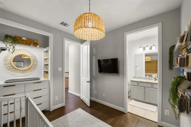 a view of a bedroom with washer and dryer
