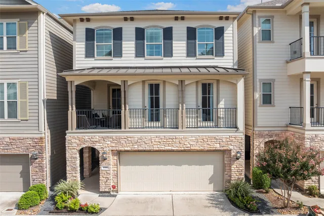 a view of a brick building with large windows