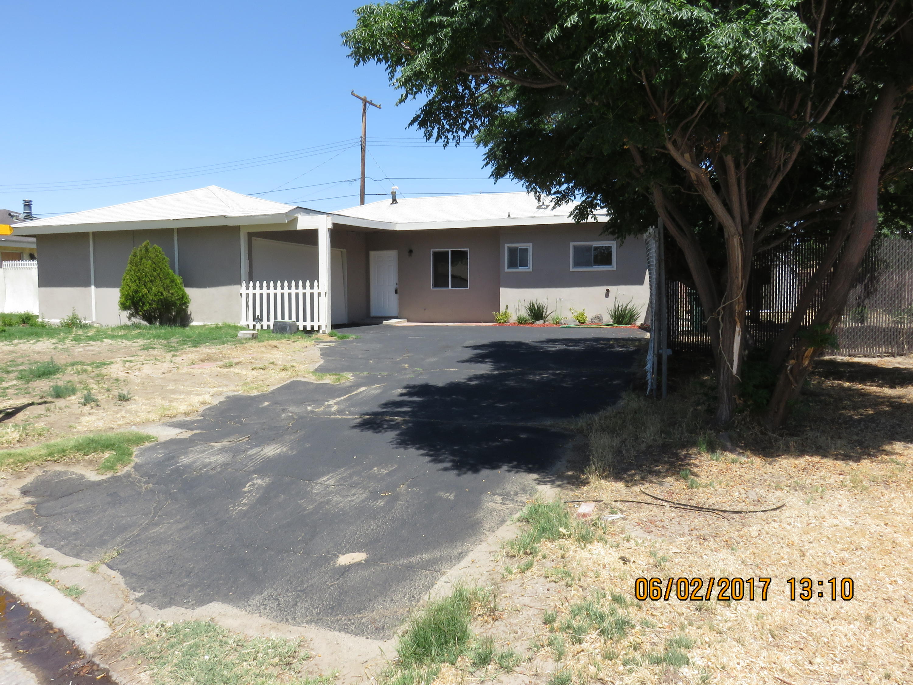 45402 Raysack Avenue Lancaster, CA 93535 - Photo 1 of 15 a front view of a house with a yard