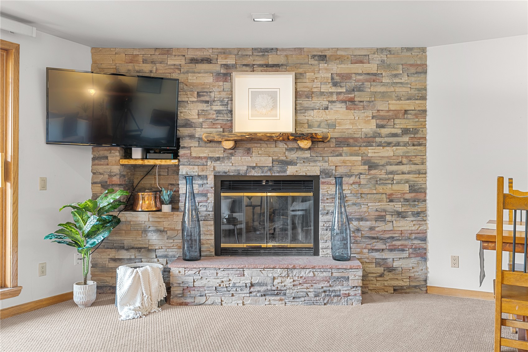 22804 Highway 6, Unit 102 Keystone, CO 80435 - Photo 5 of 34 a living room with a fireplace and a flat screen tv