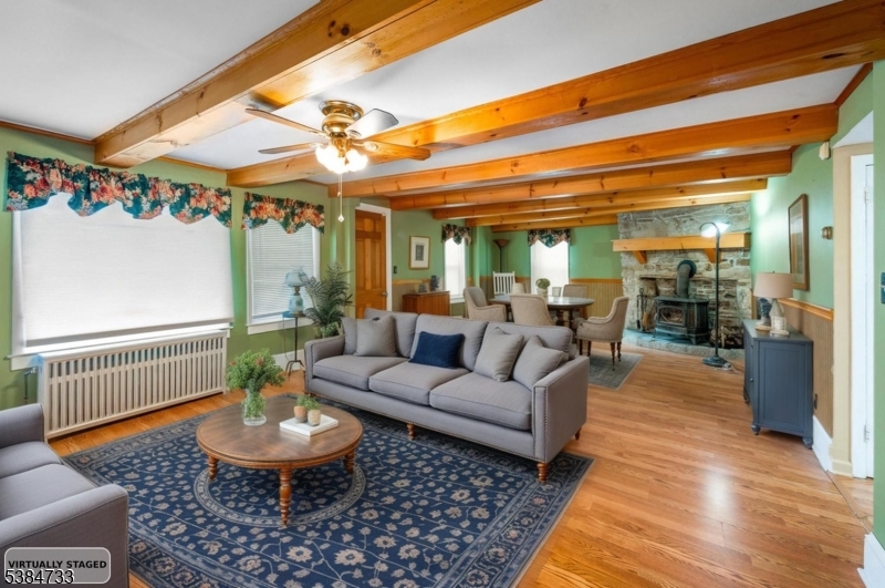 400 Quaker Church Road Randolph, NJ 07869 - Photo 12 of 34 a living room with furniture and a table