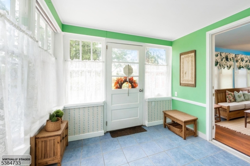 400 Quaker Church Road Randolph, NJ 07869 - Photo 2 of 34 a living room with furniture and a window