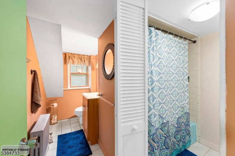 400 Quaker Church Road Randolph, NJ 07869 - Photo 27 of 34 a bathroom with a sink a mirror and a window