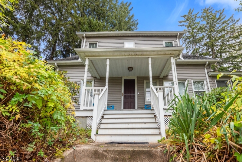 400 Quaker Church Road Randolph, NJ 07869 - Photo 3 of 34 a front view of a house with a garden