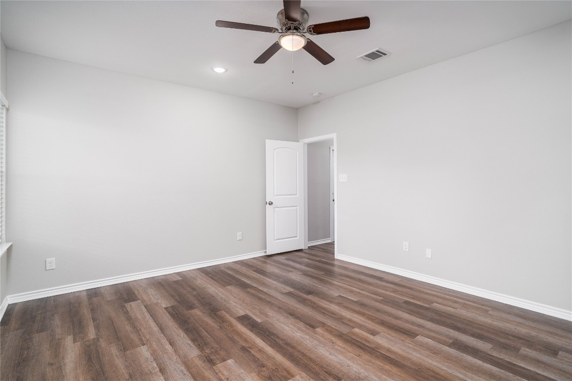 231 McCormick Street Columbus, TX 78934 - Photo 12 of 27 Primary Bedroom – Bright and airy primary retreat with an open layout and direct access to the en-suite bathroom.