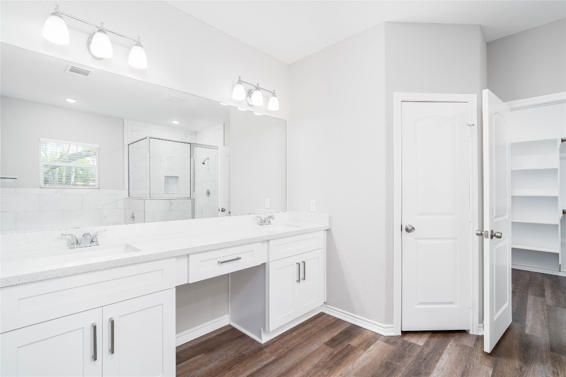 231 McCormick Street Columbus, TX 78934 - Photo 15 of 27 Primary Bathroom – Dual sink vanity with ample storage, clean lines, and a bright, polished finish.