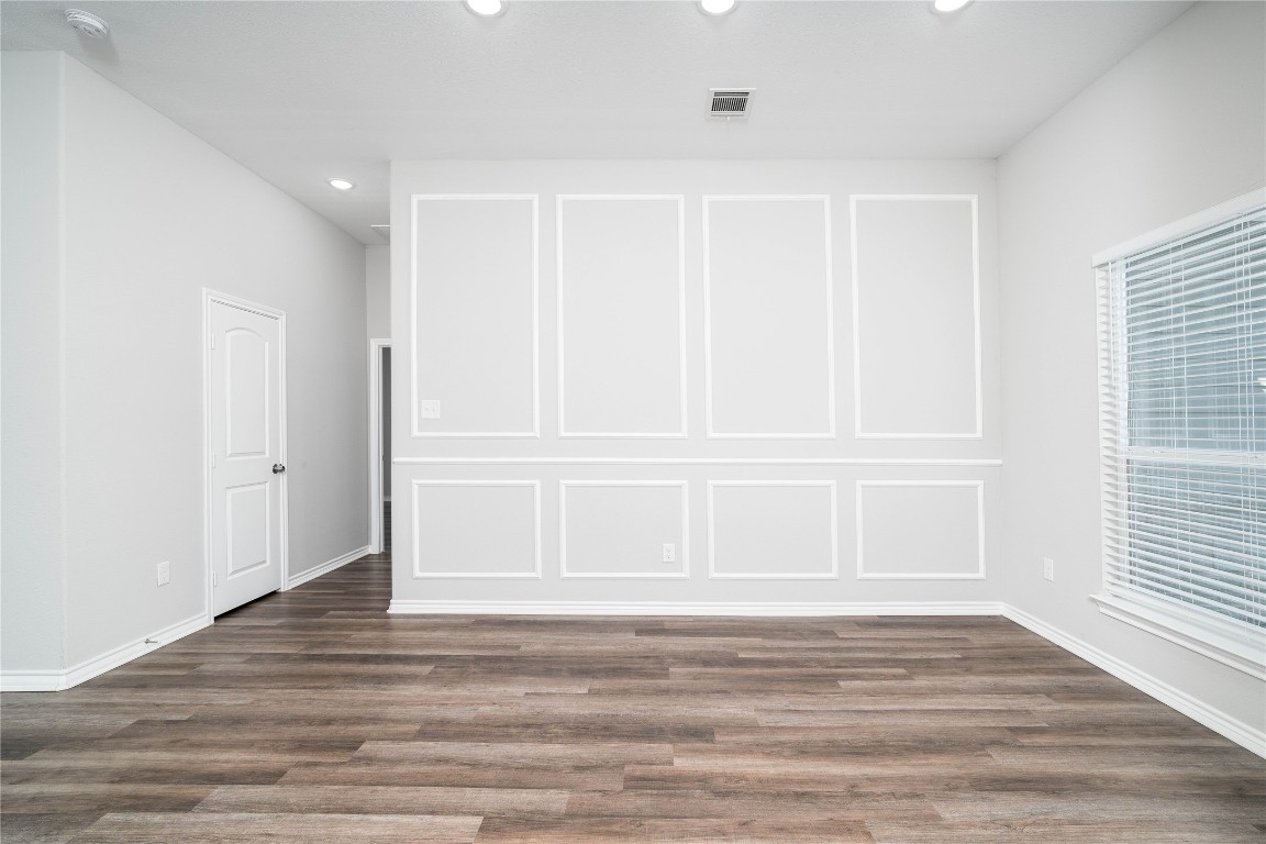 231 McCormick Street Columbus, TX 78934 - Photo 7 of 27 Dining Area – Another view of the dining area highlighting the accent wall and spacious layout for gatherings.