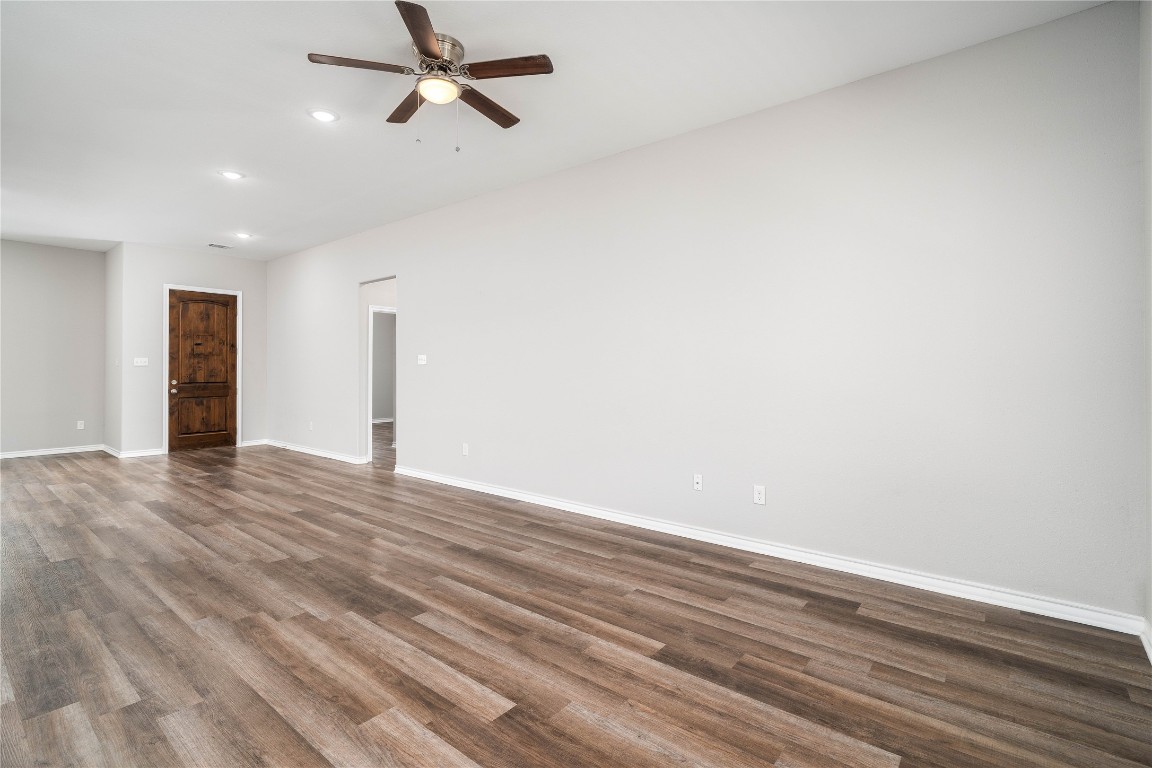 231 McCormick Street Columbus, TX 78934 - Photo 10 of 27 Living Room – Bright and versatile living room with large windows and easy access to the backyard.